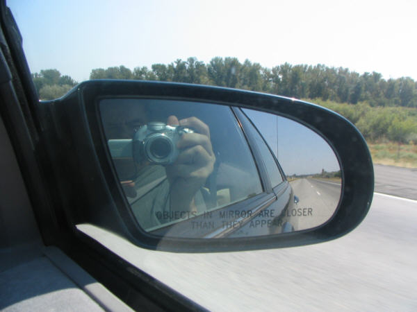 A photo out the window showing my camera in the rear view mirror.