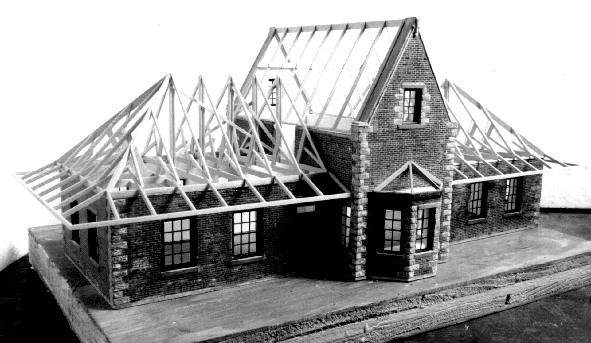 GN Passenger Depot. A front view photo of the depot shows its symetrical wings fitting into the two-story 
center section with bay window. The brick facades are nicely quioned in light sandstone.