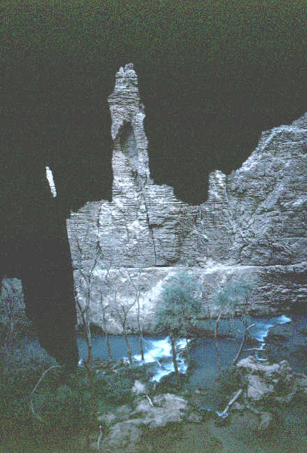 an interesting view of the falls behind a large stone fin.