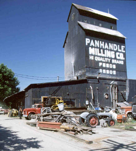 Panhandle Feeds. A grainery with lots of tractors and stuff around.