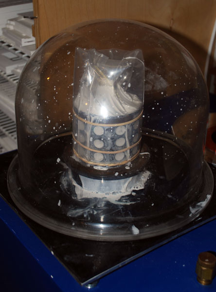 vacuuming the investment flask to remove air bubbles 444 x 600