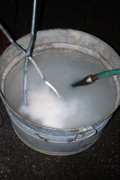 the flask is dunked in water to help remove the investment plaster 402 x 600